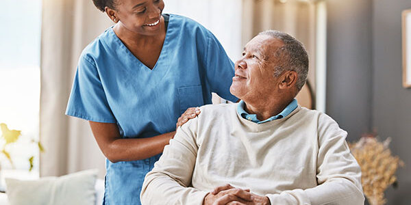 Help, support and wheelchair with nurse and old man for disability, rehabilitation or healing. Retirement, physiotherapy and healthcare with patient and black woman nursing home for medical caregiver